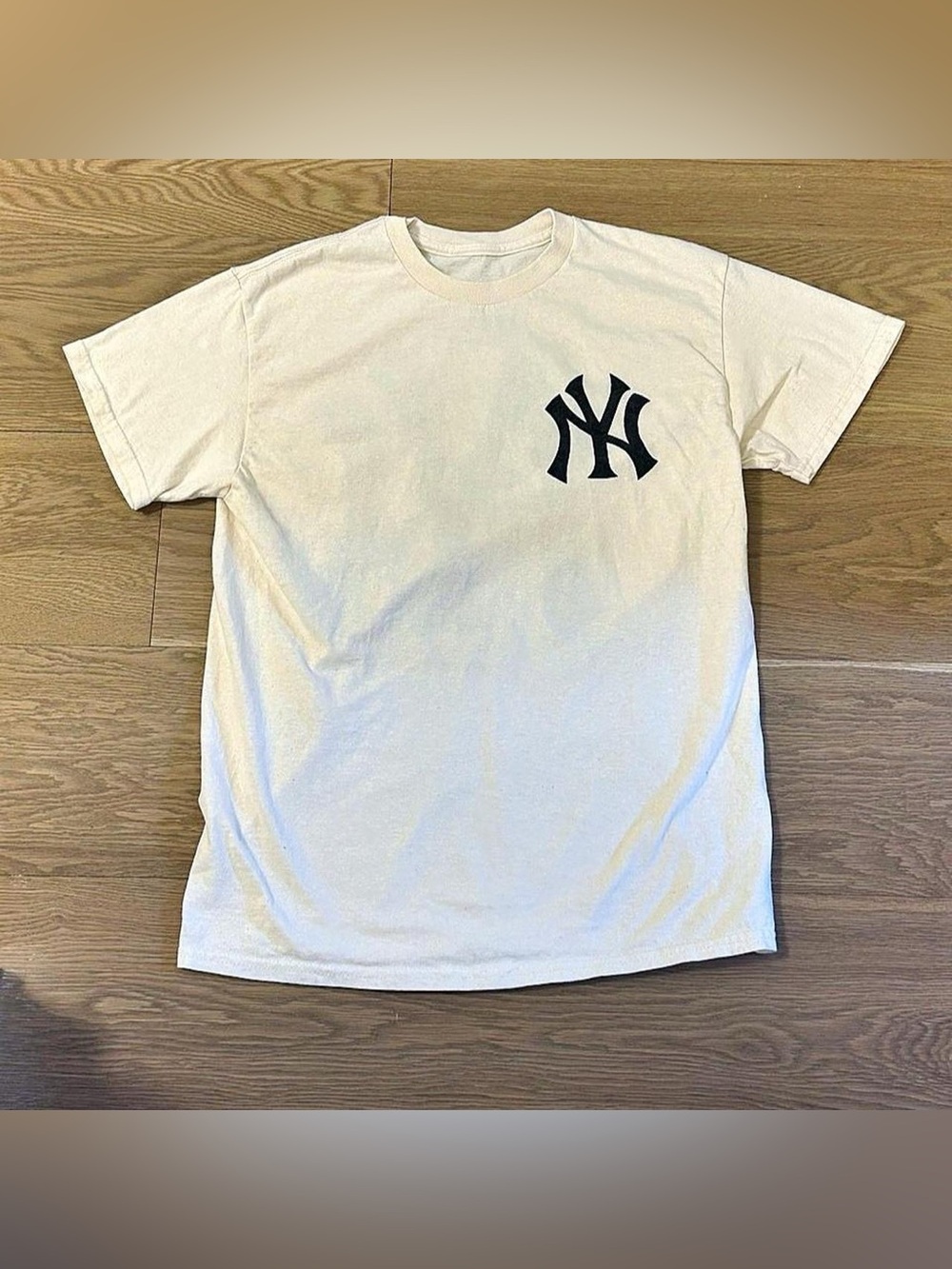 Genuine Merchandise Cream Short Sleeve Tee with Black NY Logo